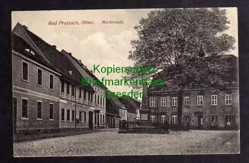 121138 AK Pretzsch Elbe um 1920 Marktplatz Denkmal Gasthof zur Friedenseiche