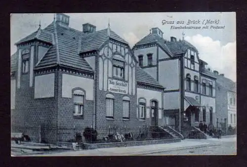 109943 Ansichtskarte Brück Mark 1908 Eisenbahnstrasse mit Postamt Bau Geschäft Gierch