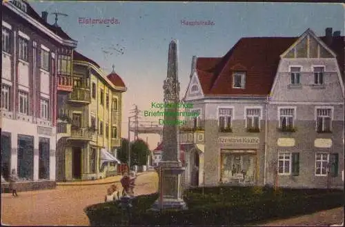 158432 AK Elsterwerda 1923 Hauptstraße Postmeilensäule Geschäft Hermann Kaube