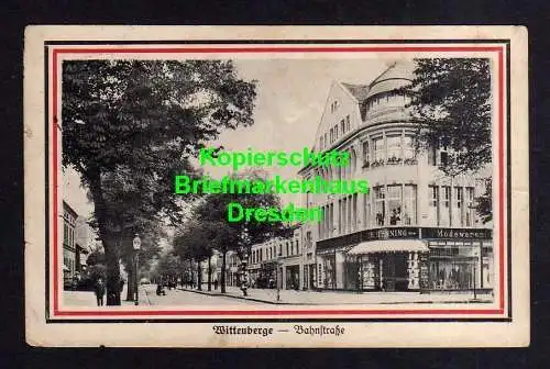 114337 Ansichtskarte Wittenberge Bez. Potsdam 1916 Bahnstraße Th. Henning Modewaren