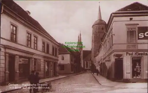 157627 AK Cöthen in Anhalt Köthen um 1920 Hallesche Straße Marktkirche Geschäft