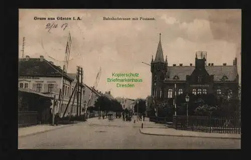 134093 AK Güsten i. A.  1907 Bahnhofstrasse mit Postamt Bahnübergang Deutsches