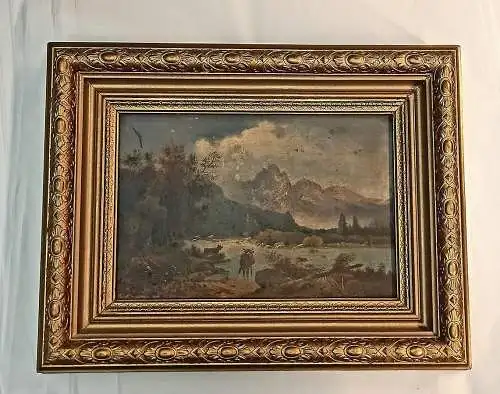 Landschaftsszene mit 2 Kühen vor Bergsee.