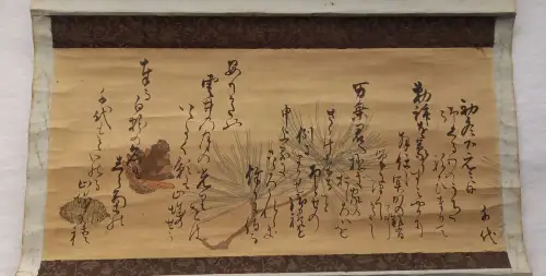 Waka poems with pine cones.