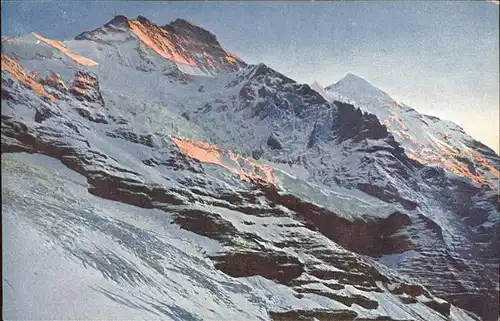 Jungfraubahn Jungfrau mit Silberhoernern Berner Alpen im Abendrot Kat. Jungfrau