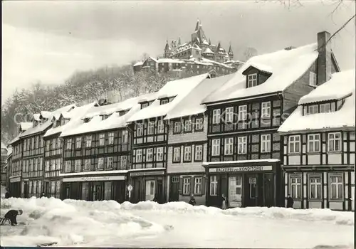 Wernigerode Harz Schoene Ecke Fachwerk mit Schloss im Schnee Kat. Wernigerode