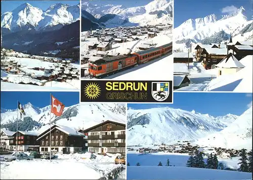 Sedrun Camischolas Dorfpartie Blick gegen Rueras und Skigebiet Val Strem Alpenpanorama Wappen Flagge Wintersportplatz Eisenbahn Zug Kat. Sedrun