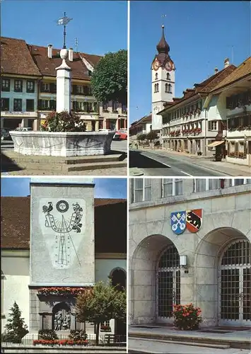 Huttwil Brunnenplatz Sonnenuhr Soldatendenkmal Marktgasse Stadthauseingang Wappen Das Blumenstaedtchen im Emmental Kat. Huttwil