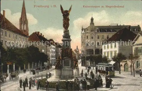 Freiburg Breisgau Kaiserstrasse Siegesdenkmal Strassenbahn Kat. Freiburg im Breisgau