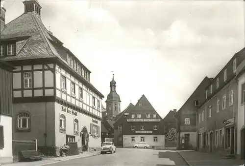 Geising Erzgebirge Hauptstrasse mit Rathaus und Kirche