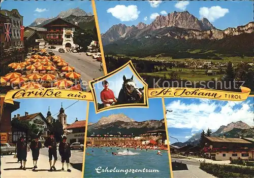 St Johann Tirol Hauptplatz Tiroler Trachten Alpenbad Erholungszentrum Bauernhaeuser Reiten Kaisergebirge Kat. St. Johann in Tirol