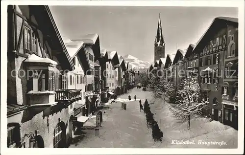 Kitzbuehel Tirol Hauptstrasse Kirchturm Pferdeschlitten Winterpanorama Kat. Kitzbuehel
