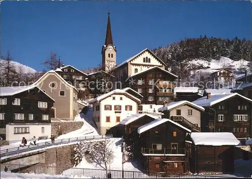 Fiesch Kirche mit typischen Gomerhaeusern Kat. Fiesch