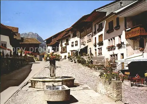 Gruyeres FR Dorfpartie mit Brunnen Kat. Gruyeres