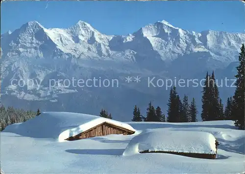 Eiger Grindelwald mit Moench und Jungfrau Verschneite Berghuetten Kat. Eiger
