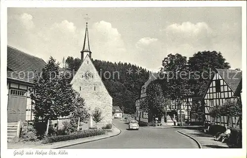 Holpe Dorfstrasse mit Kirche Auto /  /
