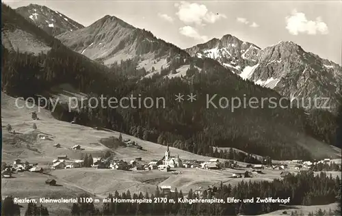 Riezlern Kleinwalsertal Vorarlberg mit Hammerspitze Kugehrenspitze Elfer und Zwoelferkopf Kat. Mittelberg