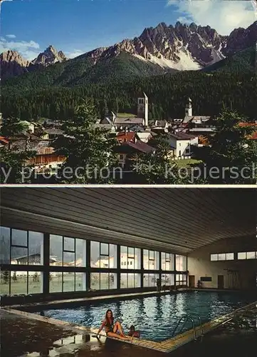 Innichen Suedtirol Ortsansicht mit Kirche Alpen Hallenschwimmbad Kat. San Candido Innichen Pustertal