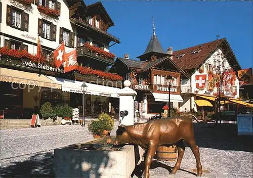 Gstaad Dorfstrasse Hotel Bronzefigur Brunnen Kat. Gstaad