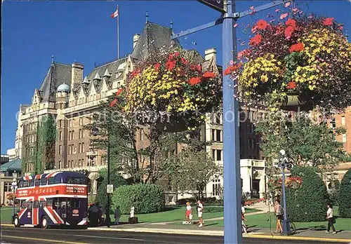 Victoria British Columbia The stately Empress Hotel and two of Victorias world renowned flower baskets Kat. Victoria