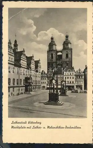 Wittenberg Lutherstadt Marktplatz mit Luther Melanchthon Denkmaelern Kat. Wittenberg