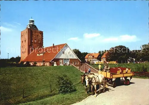 Insel Neuwerk Wattwagen vor dem ueber 650 Jahre alten Leuchtturm Schullandheim Kat. Hamburg