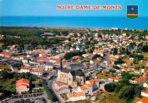 Notre Dame de Monts Fliegeraufnahme mit Kirche und Meer Kat. Notre Dame de Monts