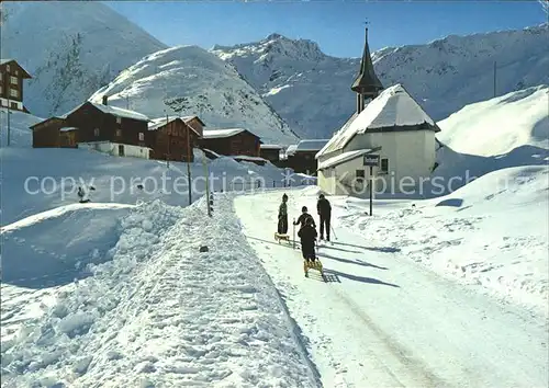 AK / Ansichtskarte Tschamutt Graubuenden Dorfpartie Kirche mit Piz Badus / Sedrun /Bz. Surselva