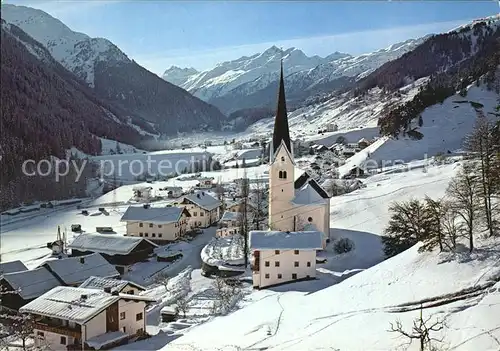 AK / Ansichtskarte St Jakob Arlberg Ortsansicht mit Kirche Alpenpanorama im Winter Kat. St. Anton am Arlberg