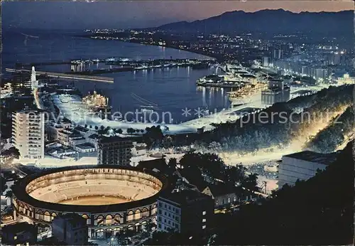 AK / Ansichtskarte Malaga Andalucia Stierkampfarena Hafen Nachtaufnahme Kat. Malaga