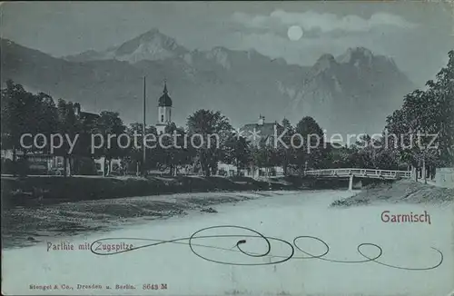 AK / Ansichtskarte Garmisch Partenkirchen Ortspartie mit Kirche und Zugspitze im Mondschein Kat. Garmisch Partenkirchen