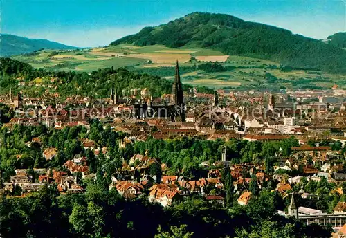AK / Ansichtskarte Freiburg Breisgau Stadtbild mit Freiburger Muenster und Schoenberg Kat. Freiburg im Breisgau