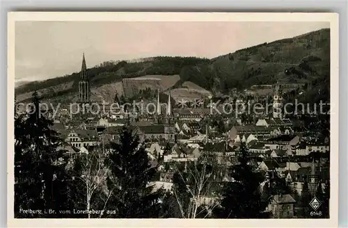 AK / Ansichtskarte Freiburg Breisgau Stadtbild mit Muenster und Kirchen Blick vom Lorettoberg Kat. Freiburg im Breisgau