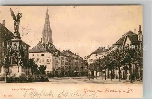 AK / Ansichtskarte Freiburg Breisgau Kaiser Wilhelm Platz Siegesdenkmal Muensterturm Kat. Freiburg im Breisgau