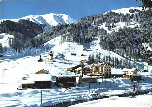 AK / Ansichtskarte Frauenkirch GR mit Hotel Post und Frauenkirchli Winterpanorama Kat. Davos