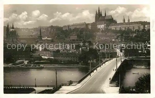 AK / Ansichtskarte Prag Prahy Prague Hradcany a Manesuv most Manesbruecke Moldau Prager Burg Kat. Praha