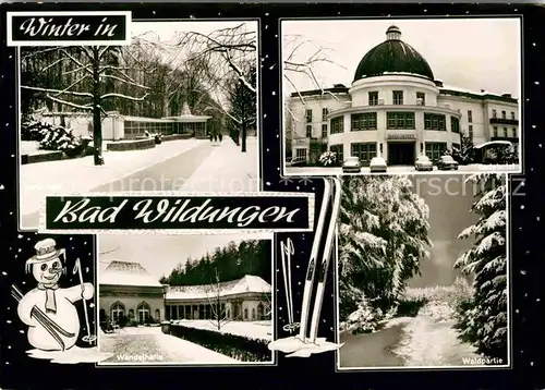 AK / Ansichtskarte Bad Wildungen Wandelhalle Badehotel Waldpartie im Winter Schneemann Skier Kat. Bad Wildungen