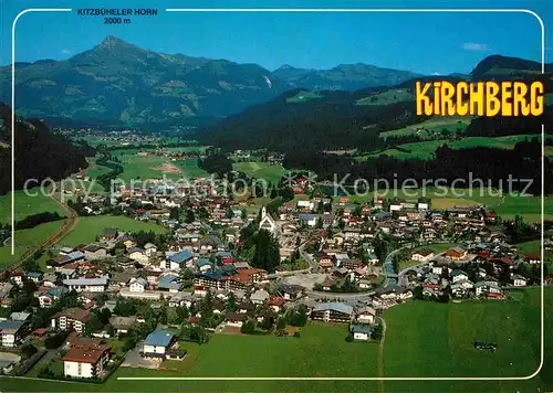 AK / Ansichtskarte Kirchberg Tirol Panorama Blick zum Kitzbueheler Horn Kitzbueheler Alpen Fliegeraufnahme Kat. Kirchberg in Tirol