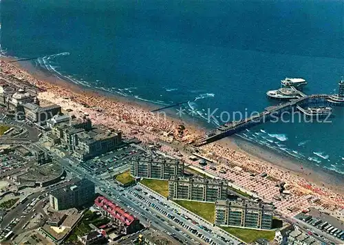 AK / Ansichtskarte Scheveningen Fliegeraufnahme mit Strand Seebruecke Pier Kat. Scheveningen