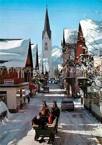 AK / Ansichtskarte Oberstdorf Kirchstrasse im Winter mit Pferdewagen  Kat. Oberstdorf