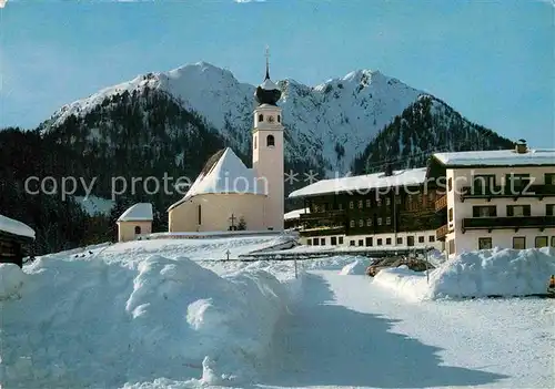 AK / Ansichtskarte Thierbach Wildschoenau Kirchenpartie im Schnee gegen Gratlspitz Kat. Wildschoenau