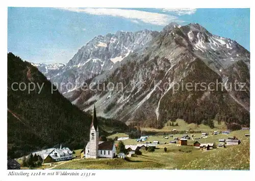 AK / Ansichtskarte Mittelberg Kleinwalsertal Ortsansicht mit Kirche Blick zum Widderstein Allgaeuer Alpen Kat. Oesterreich