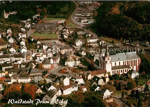 AK / Ansichtskarte Pruem Eifel Stadtbild mit Kirche Fliegeraufnahme Kat. Pruem