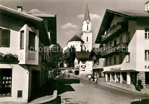 AK / Ansichtskarte Hindelang Hauptstrasse mit kath Pfarrkirche Kat. Bad Hindelang