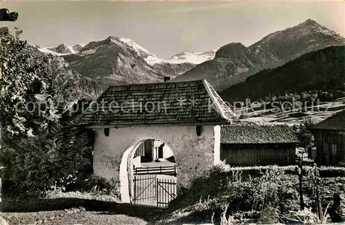 AK / Ansichtskarte Lauenen Kirchhoftor mit Wildhorn Geltenhorn Mutthorn und Spitzhorn Berner Alpen Kat. Lauenen