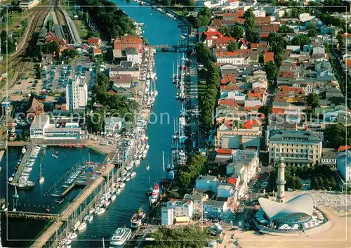 AK / Ansichtskarte Warnemuende Ostseebad Alter Strom mit Teepott und Leuchtturm Fliegeraufnahme  Kat. Rostock