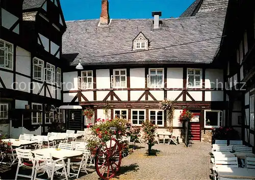 AK / Ansichtskarte Goslar Weisser Schwan in der Muenzstrasse heute Zinnfiguren Museum und Restaurant Balkangrill Fachwerkhaus Kat. Goslar