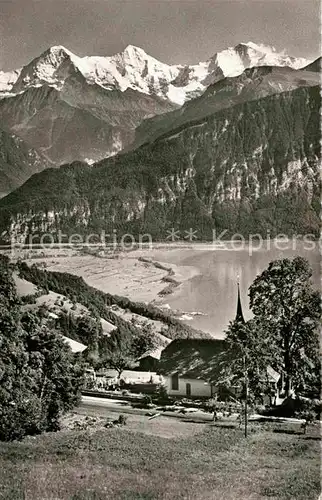 AK / Ansichtskarte Beatenberg Ev Kirche mit Eiger Moench Jungfrau Kat. Beatenberg