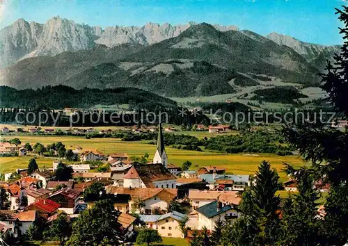 AK / Ansichtskarte Koessen Tirol Ortsansicht mit Kirche Blick gegen Kaisergebirge Kat. Koessen