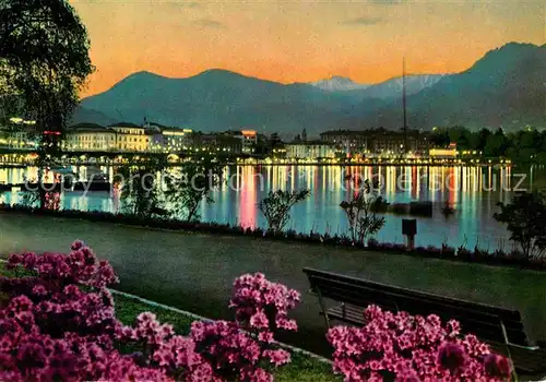 AK / Ansichtskarte Lugano TI Seepromenade am Abend Kat. Lugano